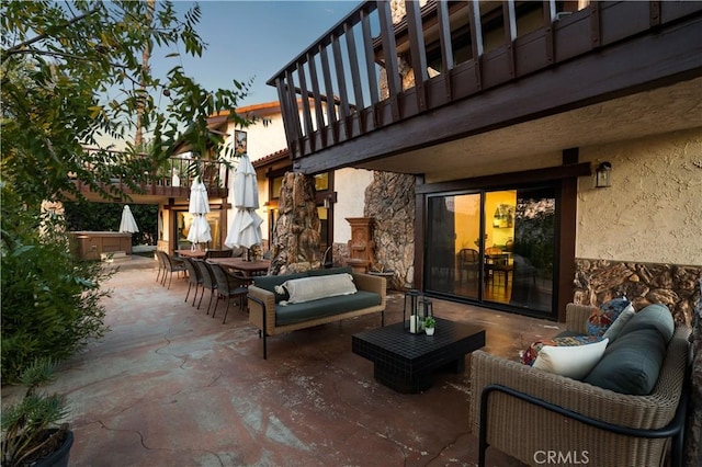 view of patio / terrace featuring an outdoor living space and a balcony