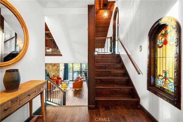 staircase featuring wood-type flooring