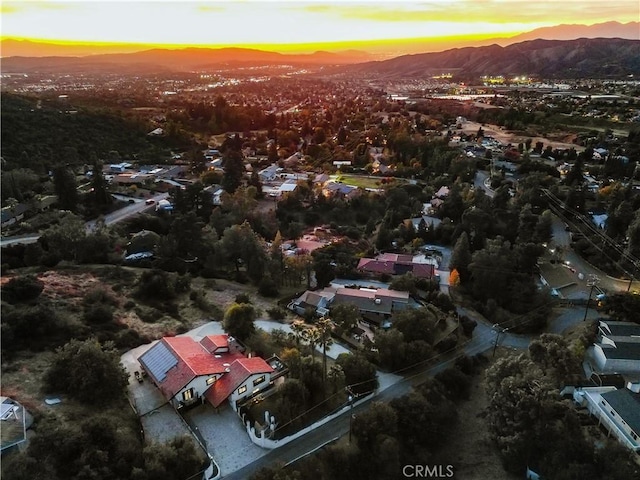 aerial view at dusk with a mountain view