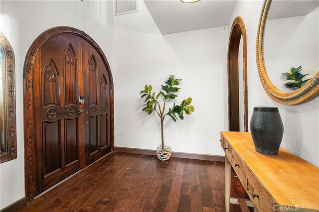 entrance foyer with dark hardwood / wood-style floors