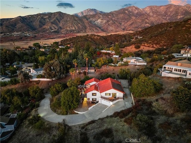 aerial view at dusk with a mountain view