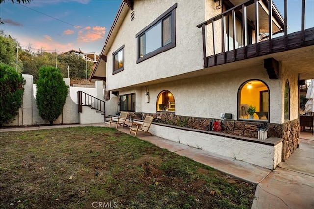 exterior space with a balcony and a patio