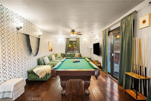 playroom featuring a textured ceiling, dark hardwood / wood-style floors, ceiling fan, and billiards