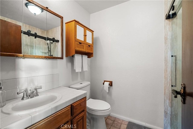 bathroom with vanity, toilet, and walk in shower