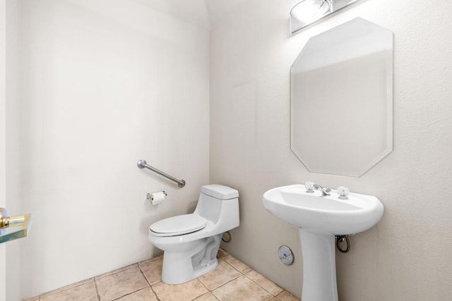 bathroom with tile patterned floors and toilet