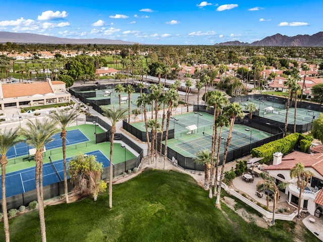 birds eye view of property with a mountain view