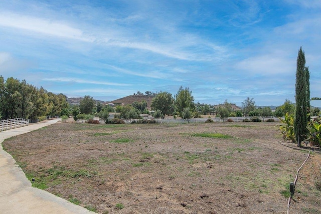 view of yard featuring a mountain view and a rural view