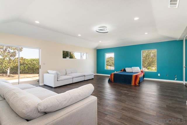 bedroom featuring access to exterior and dark wood-type flooring