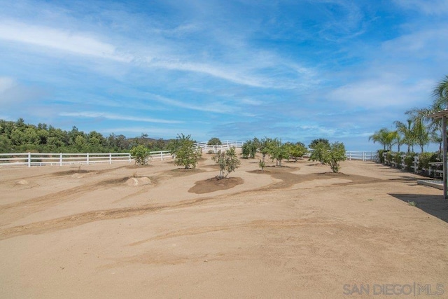 view of yard with a rural view