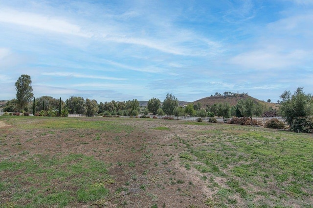 view of yard featuring a mountain view and a rural view