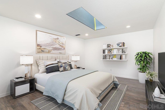 bedroom featuring dark wood-type flooring