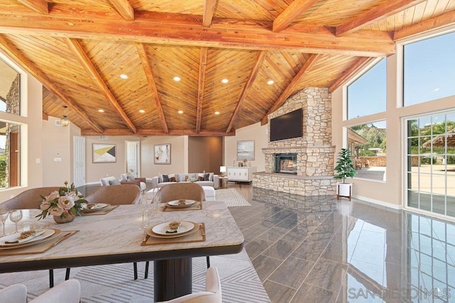 dining room featuring beamed ceiling and wood ceiling