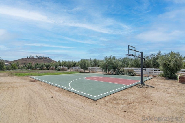 view of basketball court with a mountain view