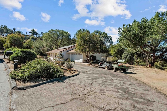 ranch-style house featuring a garage