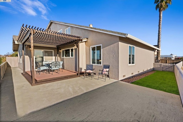 back of house with a pergola and a patio area