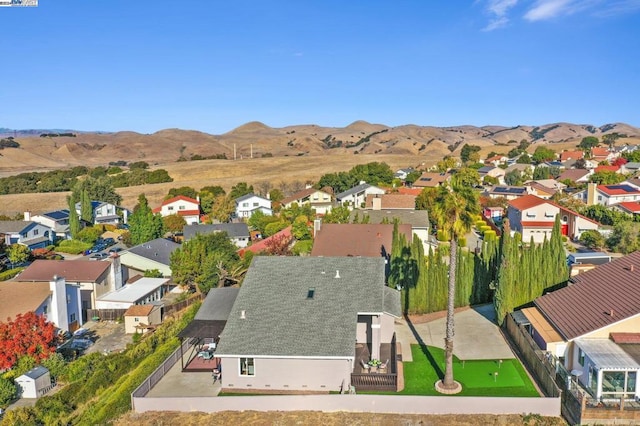 birds eye view of property featuring a mountain view