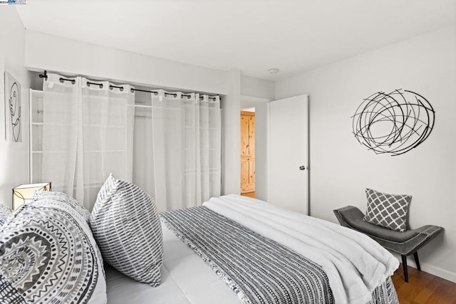 bedroom featuring hardwood / wood-style floors