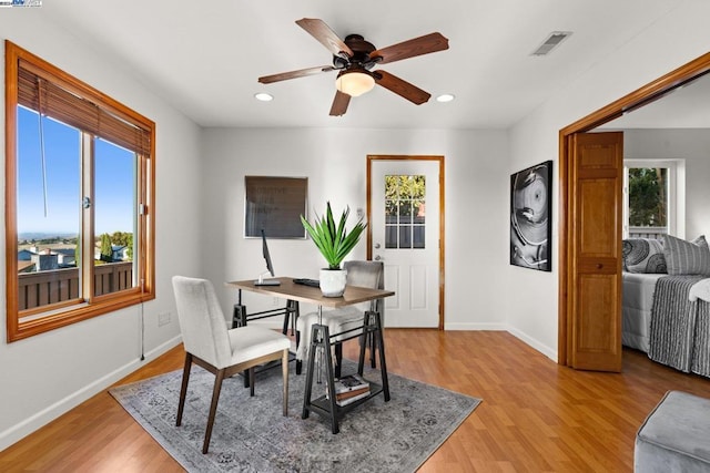 dining room featuring light wood-type flooring and ceiling fan