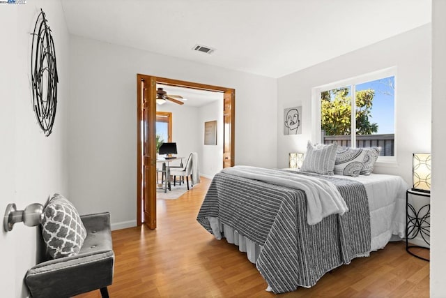 bedroom with wood-type flooring