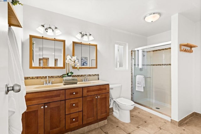 bathroom featuring tile patterned floors, vanity, toilet, and walk in shower