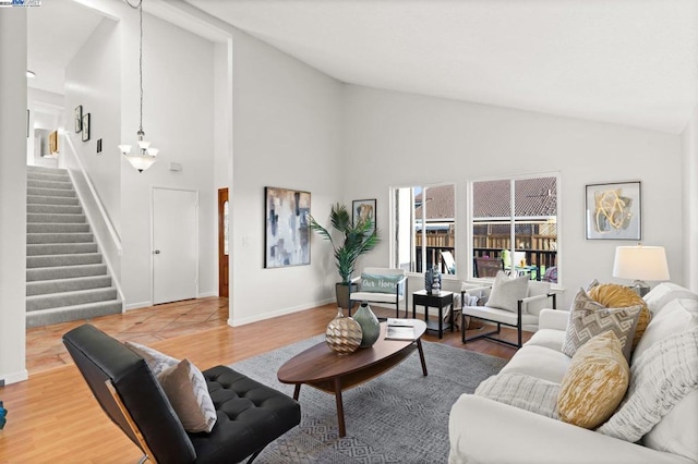 living room featuring hardwood / wood-style flooring and high vaulted ceiling