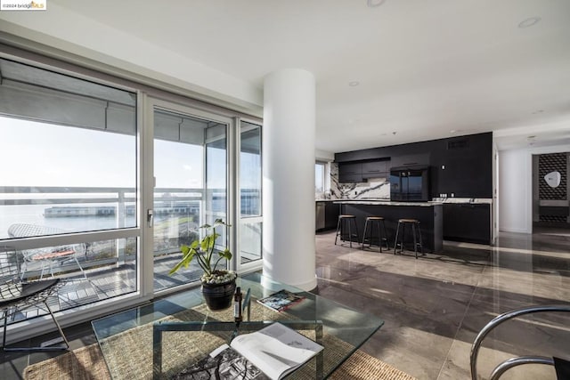 living room featuring a water view