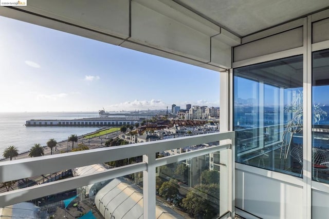 balcony featuring a water view