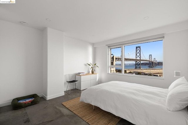 bedroom featuring a water view