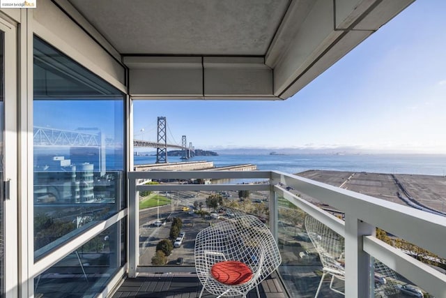 balcony featuring a water view