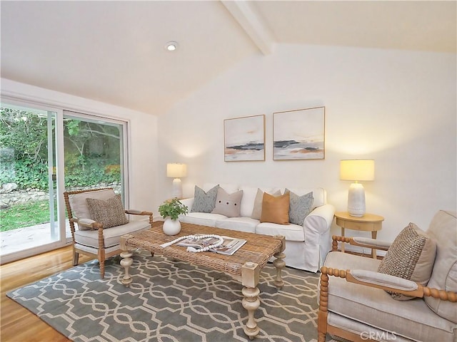 living room with vaulted ceiling with beams and dark hardwood / wood-style floors