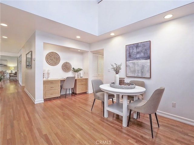 dining space featuring light wood-type flooring