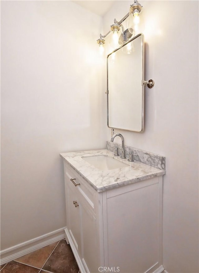 bathroom with tile patterned floors and vanity