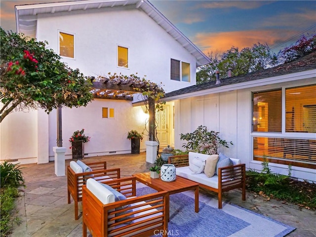 patio terrace at dusk with an outdoor hangout area