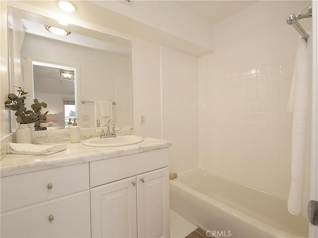 bathroom featuring shower / bathing tub combination and vanity