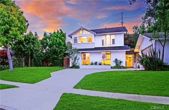 contemporary home with a yard