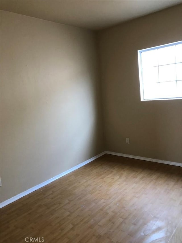 empty room featuring wood-type flooring