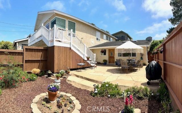 rear view of house featuring a patio