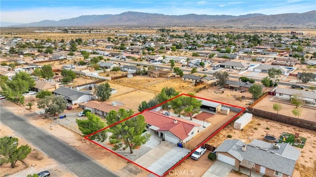 birds eye view of property with a mountain view