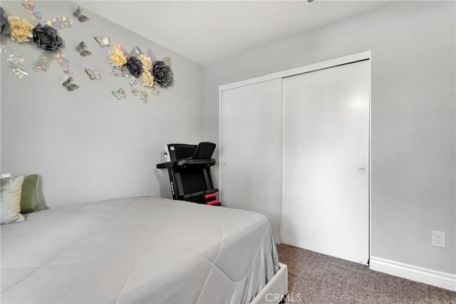 bedroom with carpet floors and a closet