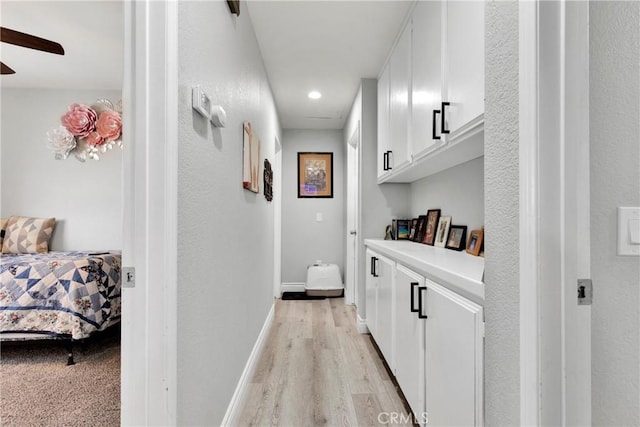 corridor featuring light hardwood / wood-style flooring