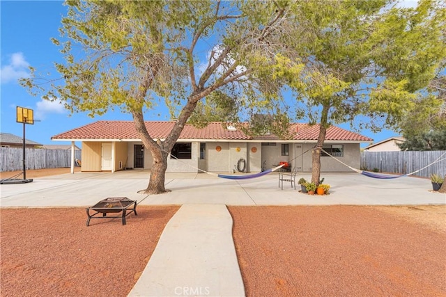 view of front of home with a fire pit