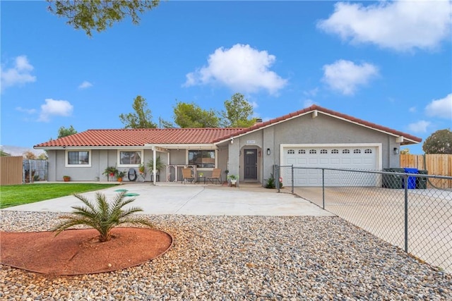 ranch-style home featuring a garage