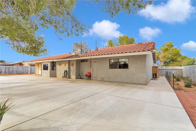 back of house featuring a patio area and central AC unit