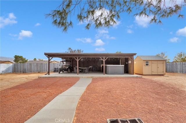 exterior space featuring a storage unit and a patio area