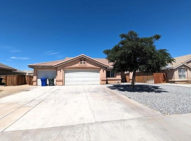 ranch-style house featuring a garage