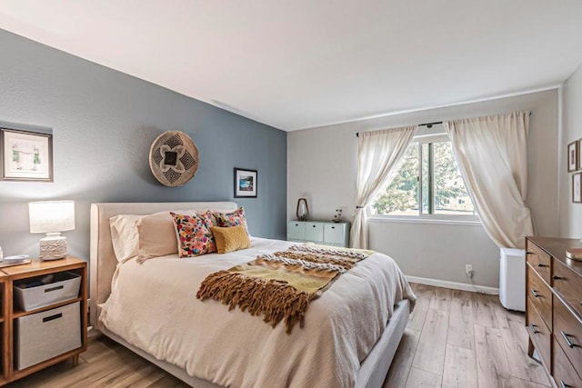 bedroom with light hardwood / wood-style floors