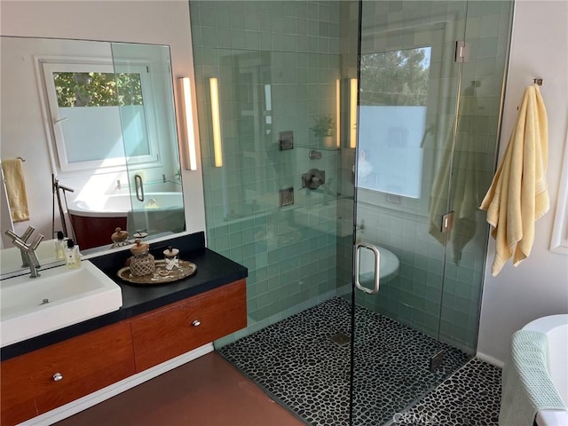 bathroom with tile patterned flooring, vanity, and an enclosed shower