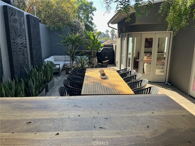 view of patio with french doors and an outdoor hangout area