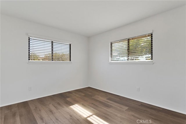 empty room featuring hardwood / wood-style flooring