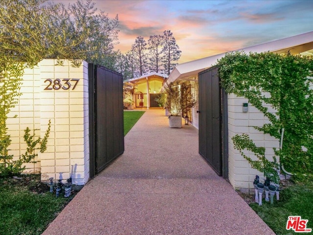 view of gate at dusk